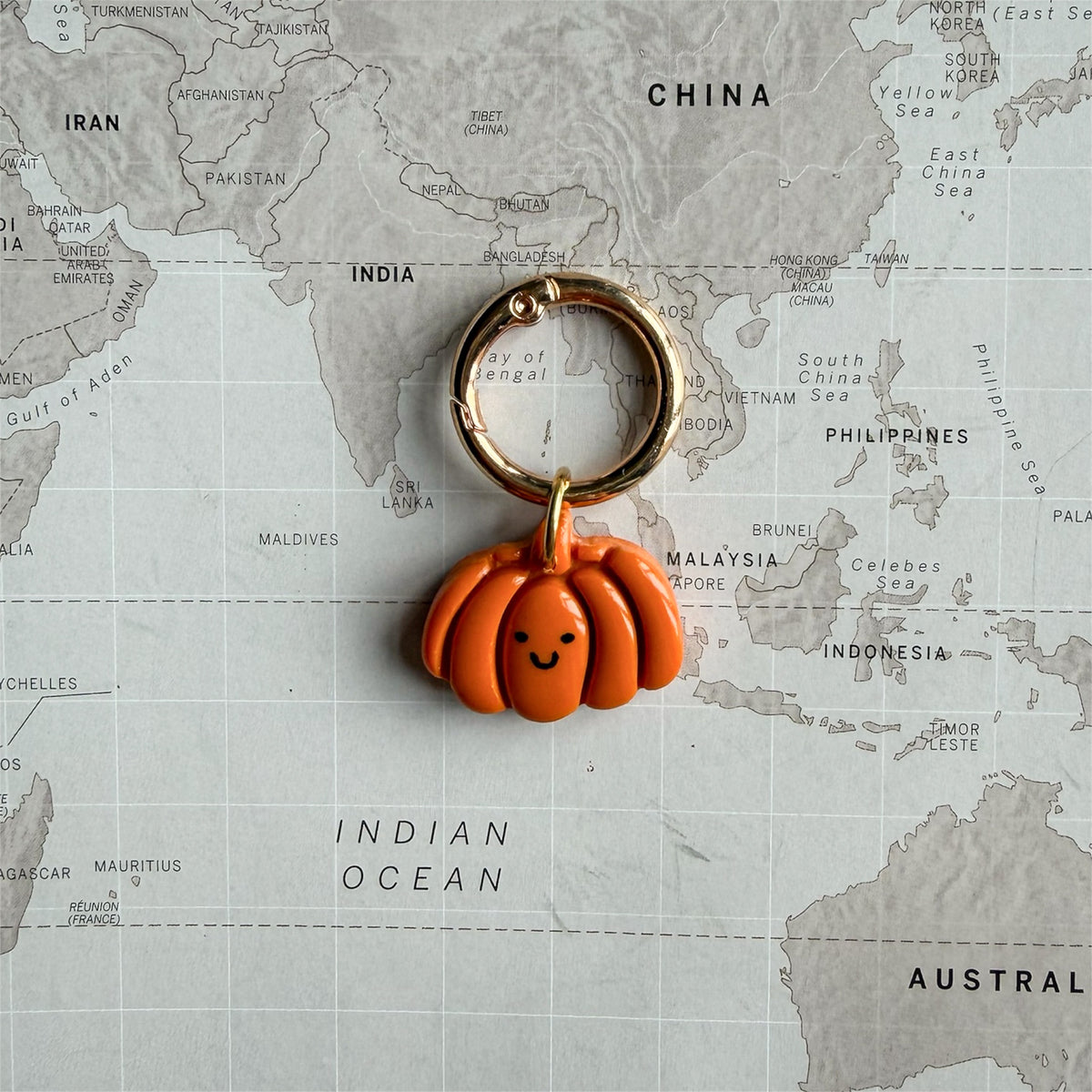 Personalised Happy Pumpkin Halloween dog tag with a cute smiley face