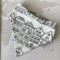 A dog bandana with Amsterdam print on a world map background.