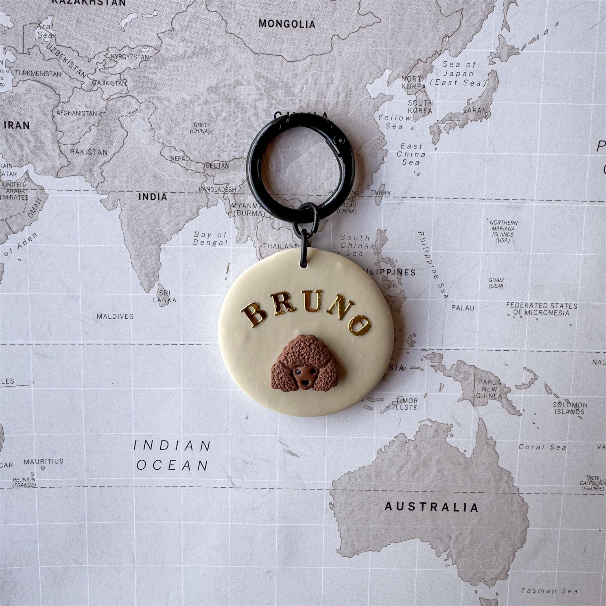 Personalised poodle dog tag handmade polymer clay gold lettering by Bruno Amsterdam size M