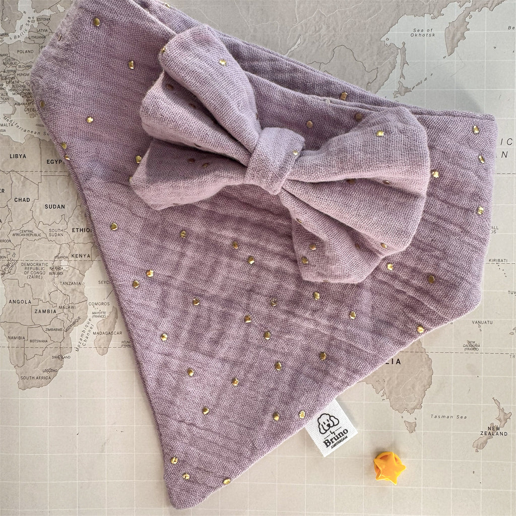 Purple dog bandana with gold studs on a map background.

