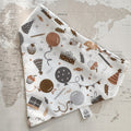 White dog bandana with balloons, wrapped gifts, cupcakes and party hats on a world map background.