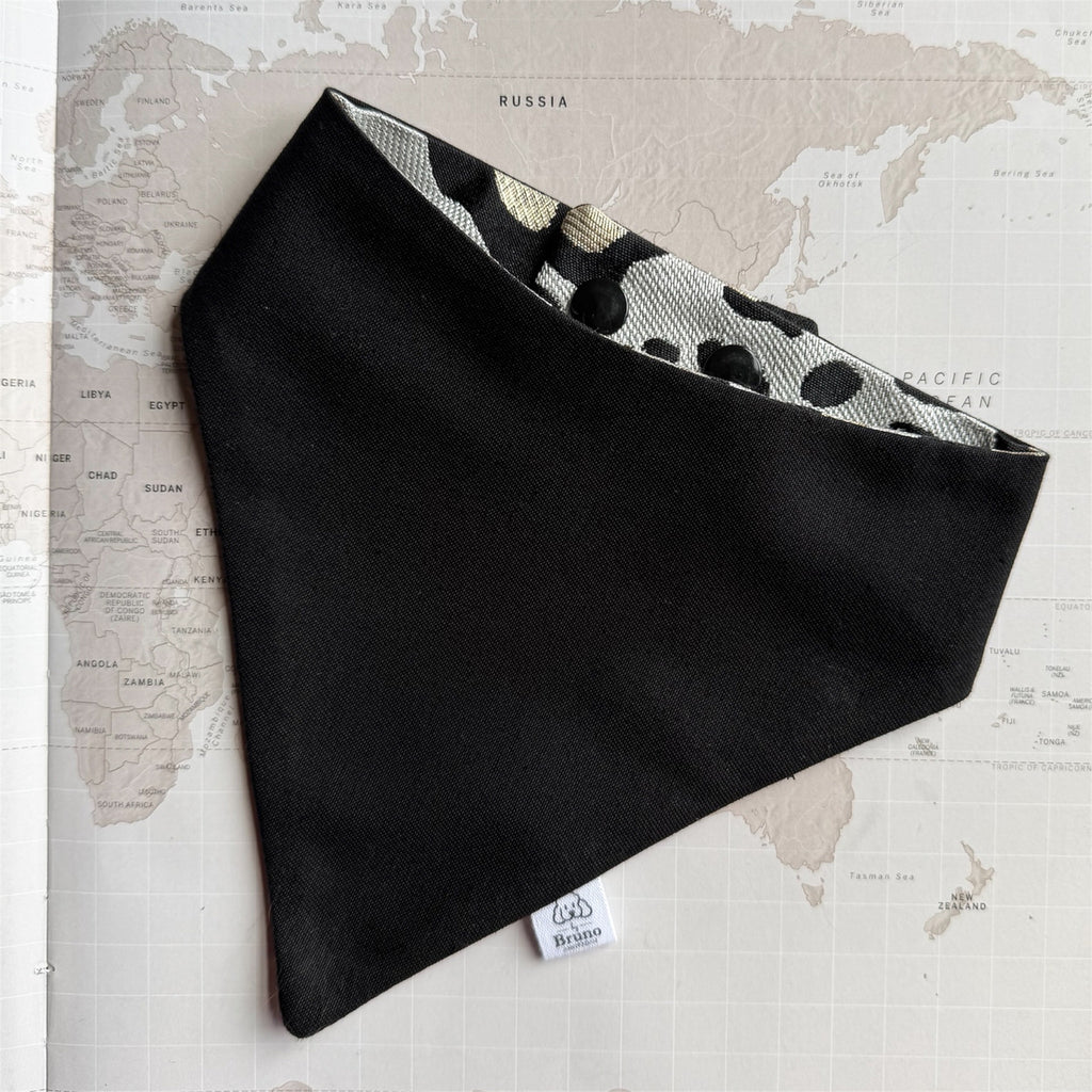 Black dog bandana with the leopard print on the other side.