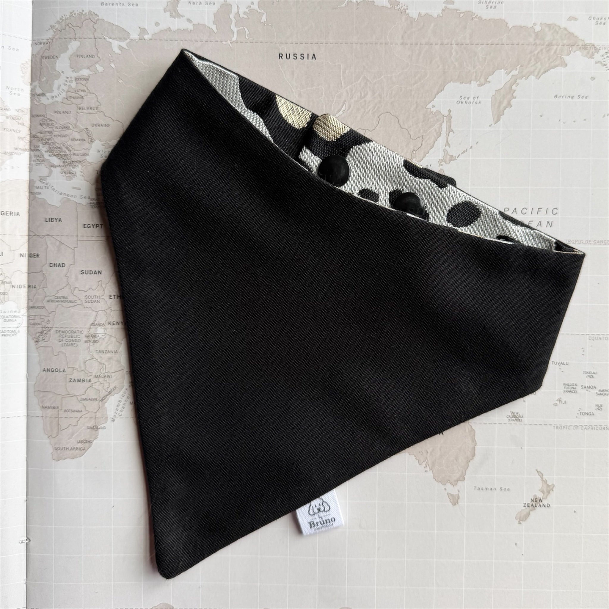 Black dog bandana with the leopard print on the other side.