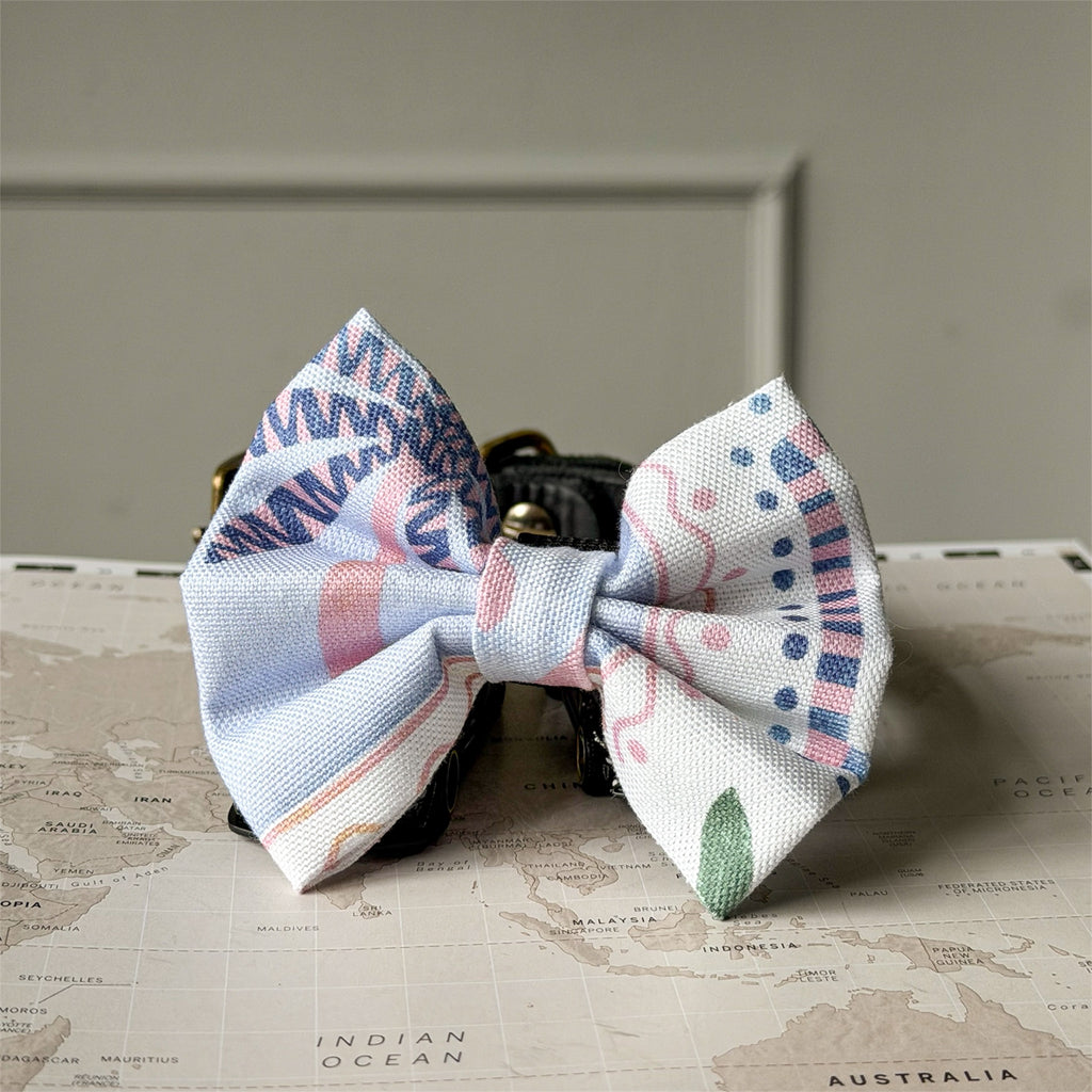 La Dolce Vita bow on a neutral background.