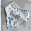 Handmade Italy dog bandana featuring illustrated Italian landmarks, pizza, pasta and gelato, displayed on a vintage world map.