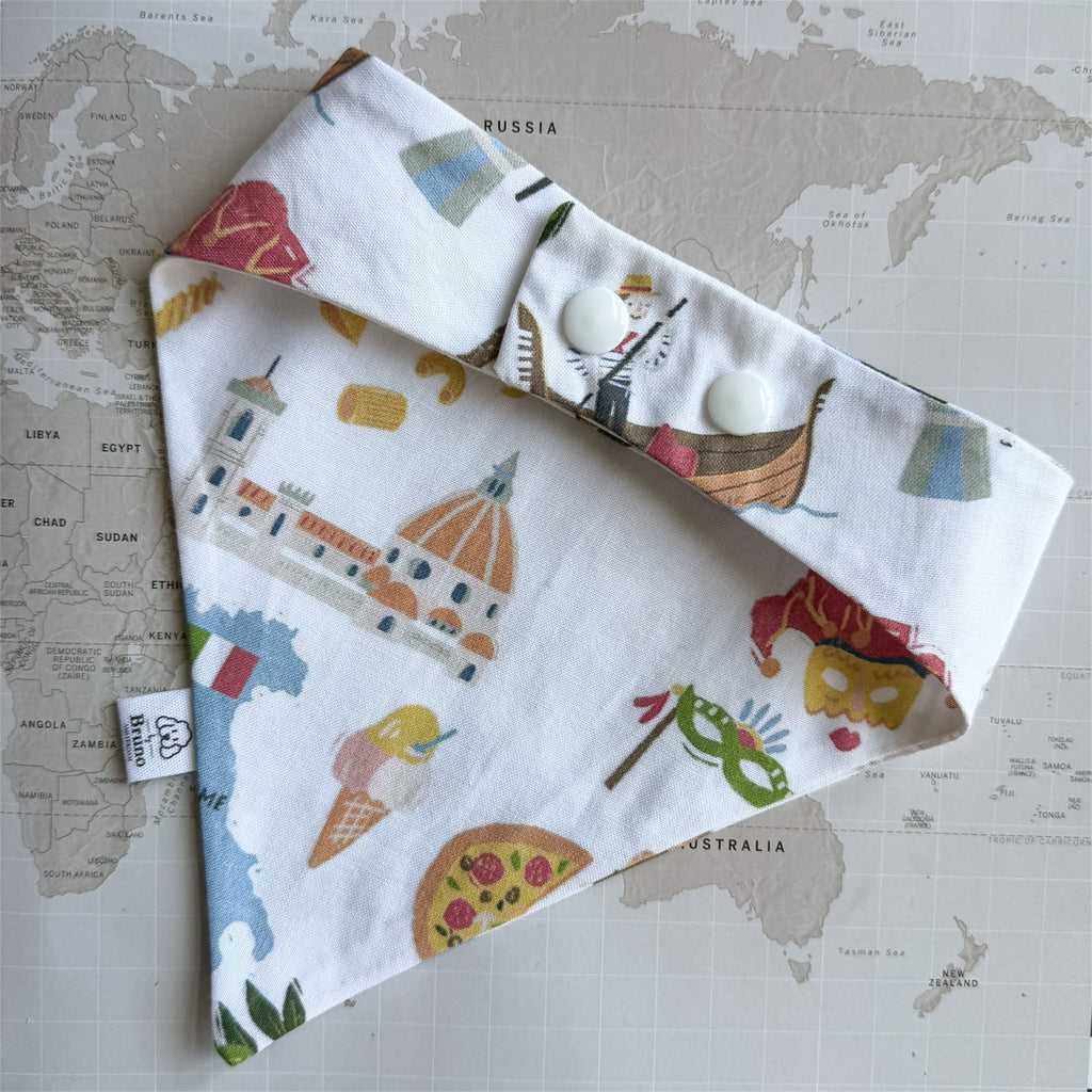 Back view of the handmade Italy dog bandana with adjustable snap closure and illustrated Italian travel print.